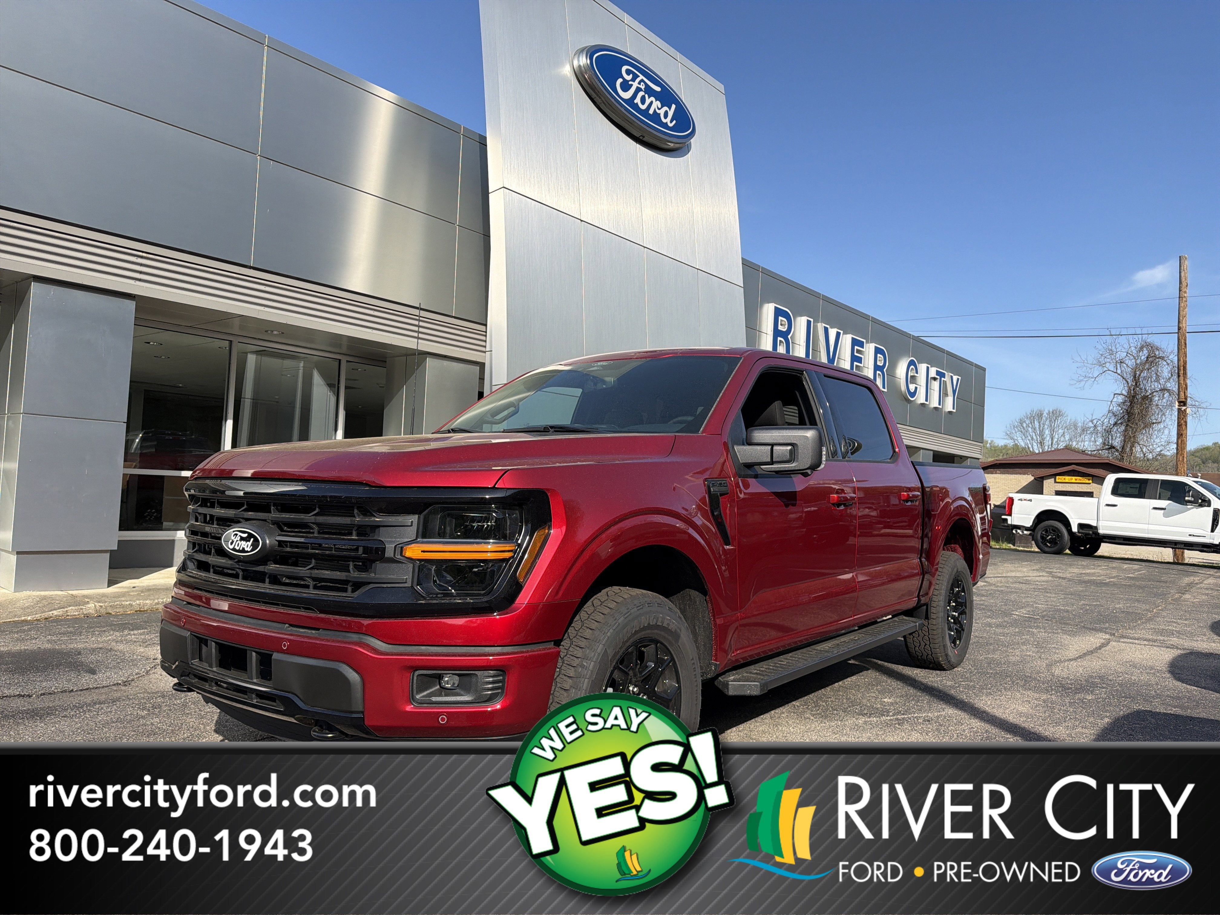 2026 Ford F-150 XLT in Ruby Red Metallic Tinted Clearcoat — front three-quarter view